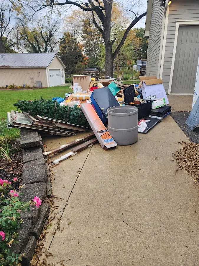Dumpster being loaded with debris for Residential Dumpster Rental in Sullivan